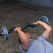 Close-up of a male athlete performing a tricep skull crusher with the Body-Solid FAT CURL BAR OB48F, highlighting the thick 2" grip and focused tricep engagement during the exercise.