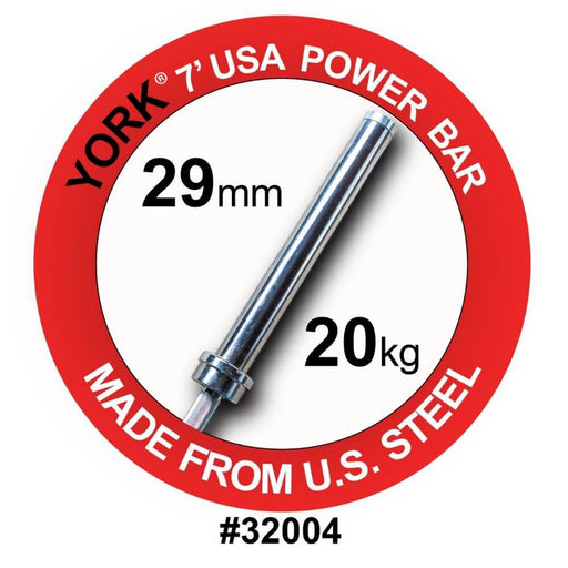 York Barbell 7’ USA Power Bar displayed in a circular diagram, highlighting key features such as 29mm shaft diameter, satin chrome finish, 1500 lb test rating, aggressive knurling, and high-quality U.S. steel construction