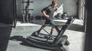 Athlete jogging on the Tru Grit Grit Runner Curved Treadmill

