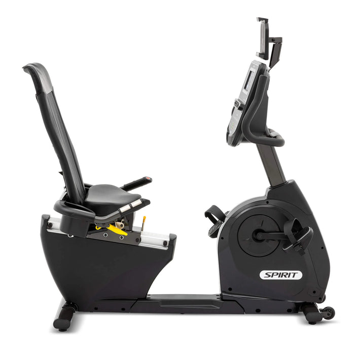 Side view of the Spirit Fitness XBR95 Recumbent Bike showing the adjustable high-density foam seat and large cushioned pedals left to right 