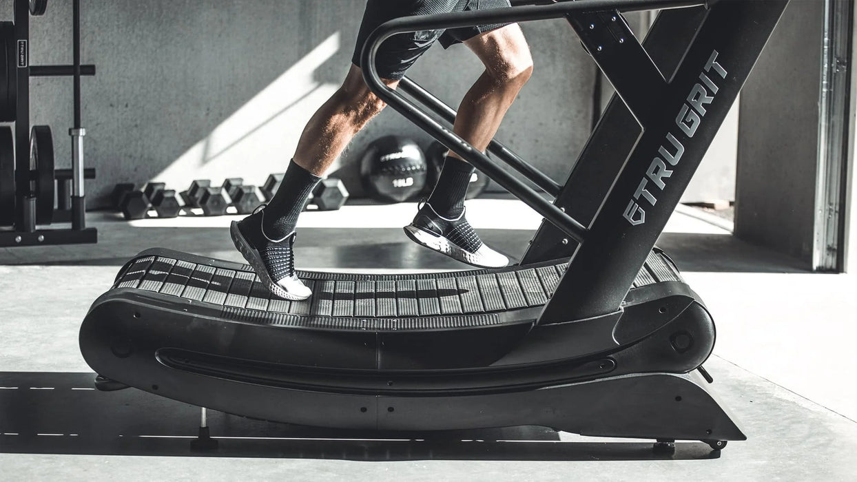 Close-up of athlete tracking progress on the Tru Grit Grit Runner treadmill