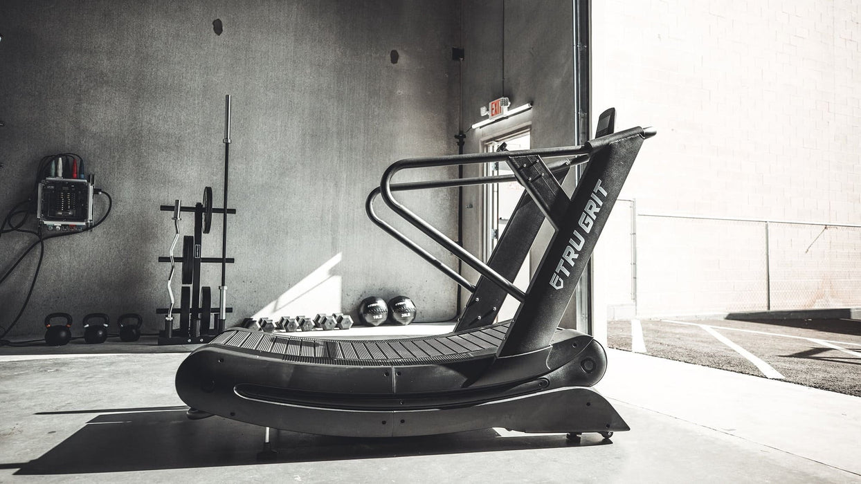 Tru Grit Grit Runner treadmill placed in a garage gym setup