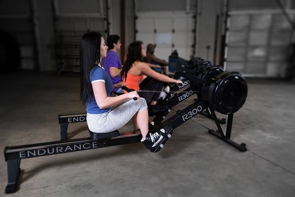 r300 rower machine in use with women fitness club