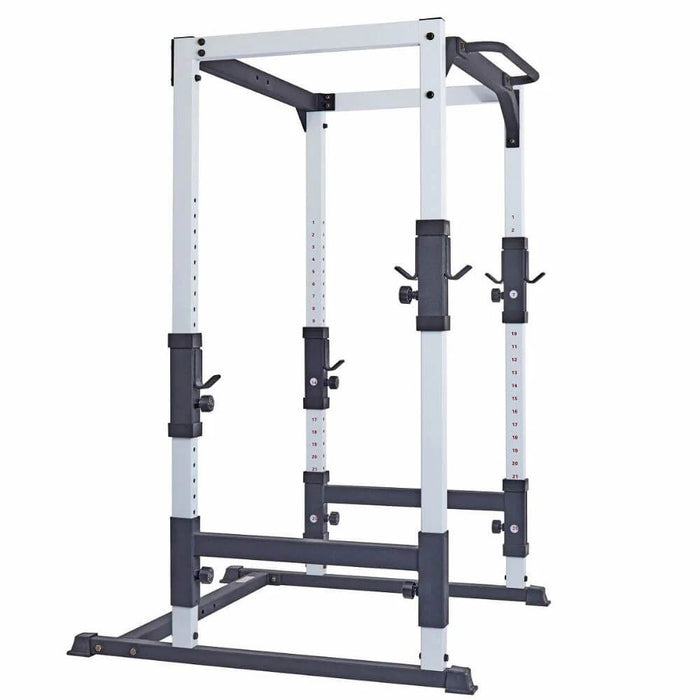 Side view of the York Barbell FTS Power Cage 48053 showcasing its sturdy frame, compact design, adjustable bar positions, and integrated chin-up bar, ideal for strength training in small spaces.