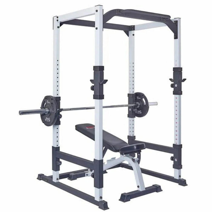 York Barbell FTS Power Cage 48053 equipped with a barbell, weight plates, and bench, demonstrating a complete strength training setup for squats, presses, and more.