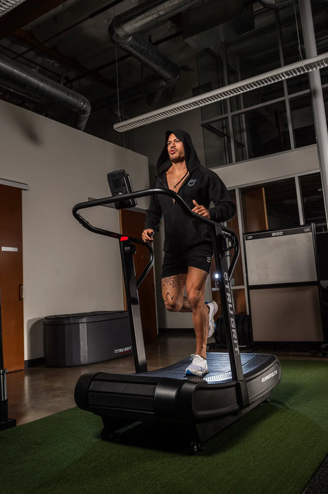 athlete running on the Grit Runner Elite treadmill