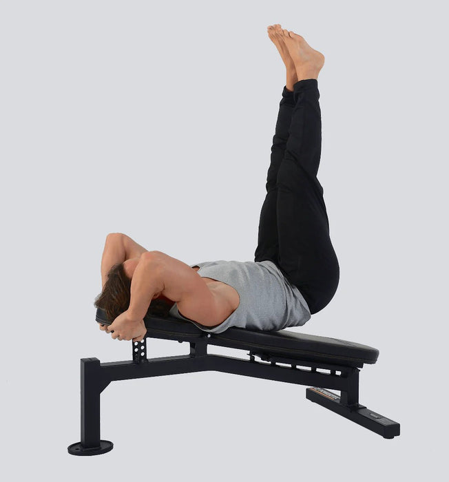 Athlete performing leg lifts in the decline position on Powertec Streamline Utility Bench WB-UBS18.
