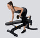 Athlete performing single-arm row on the flat bench position of Powertec Workbench FID Bench WB-UB20.